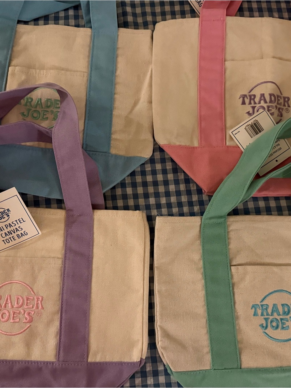 A set of 4 Trader Joe's Mini Canvas Tote Bags